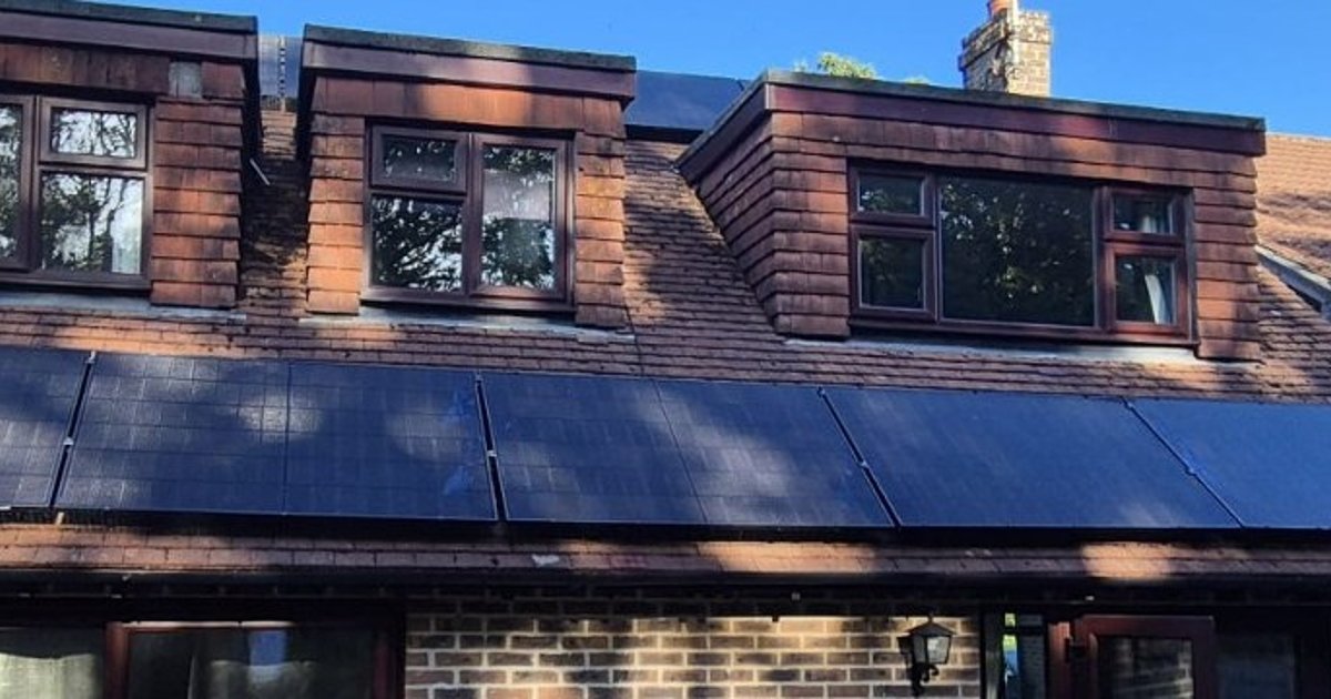 Solar panels fitted across a tiled roof in a supplied Cozy Home Solutions installation photograph